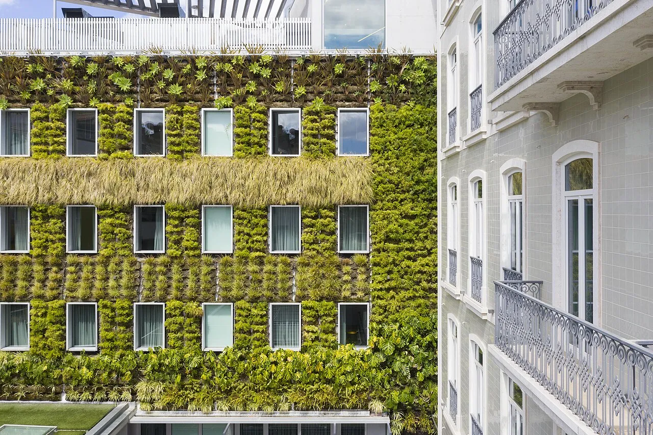 Green planted facade inside the BessaHotel Liberdade courtyard